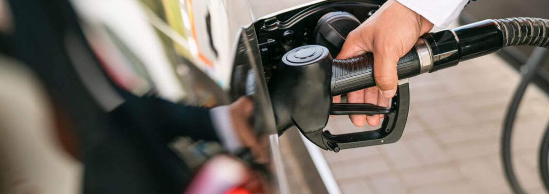 Customer fills up at gas station.