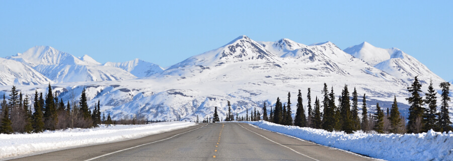 Snowy Alaskan mountains on a road.