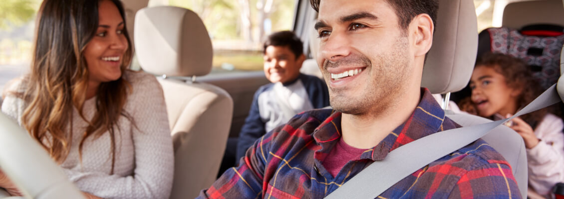 Family inside of their vehicle.